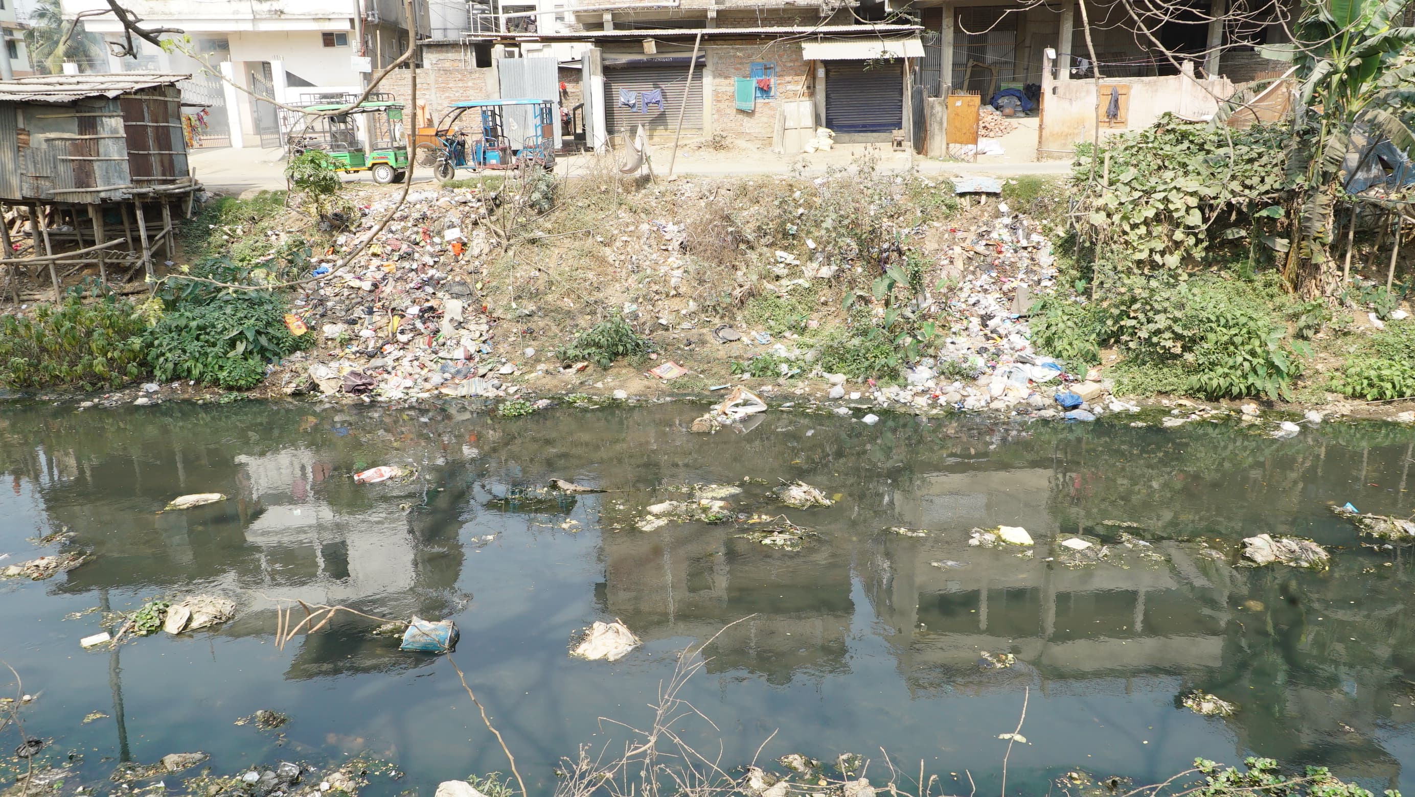 Garbage polluting the stream in Guwahati's Dakhingaon.